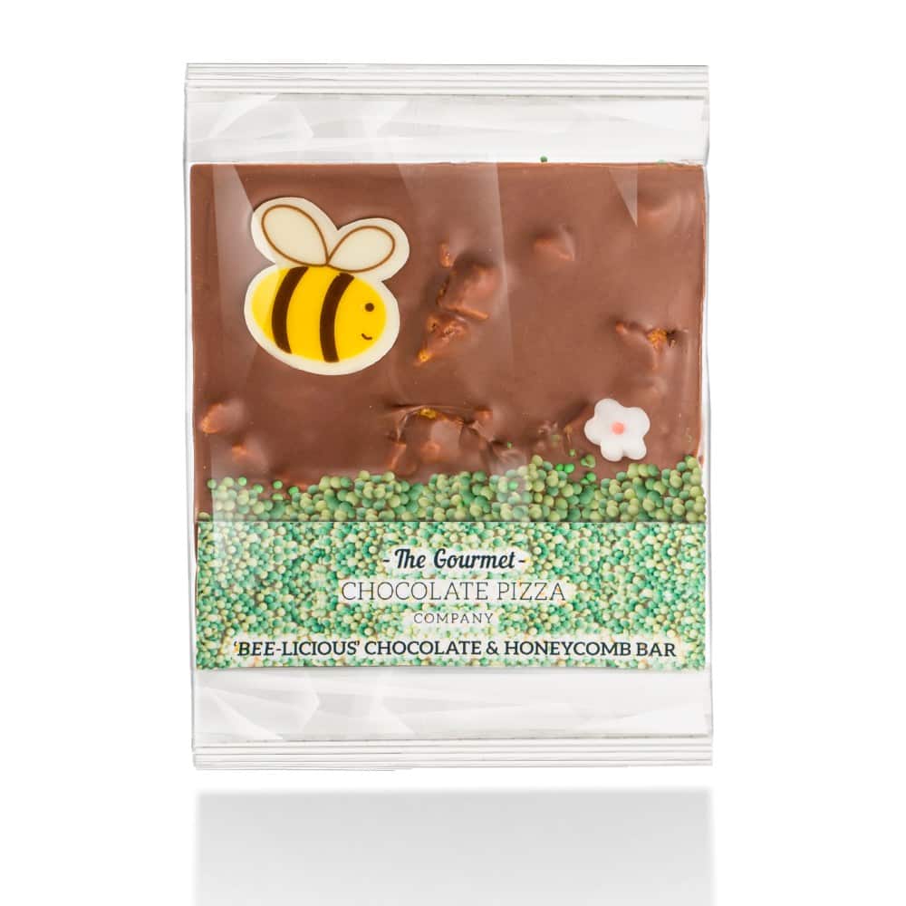 Our new Bee-licious Bars are made with Belgian milk chocolate and honeycomb, and are decorated with a white chocolate bee, mini sugar flower and green grass sprinkles.